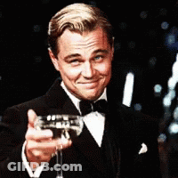 Man In Tuxedo Holding Wine Glass GIF