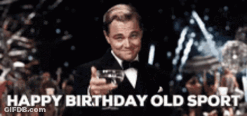 Man In Tuxedo Holding Wine Saying Happy Birthday GIF