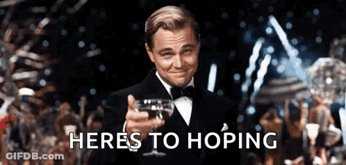 Man In Tuxedo Holding Wine Saying Heres To Hoping GIF