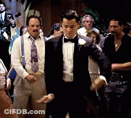 Man In Tuxedo In Front Of Crowd GIF
