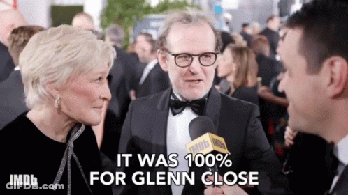 Man In Tuxedo Interviewed By Woman With IMDB Microphone GIF