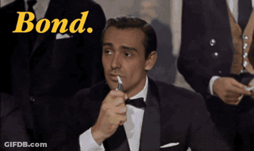 Man In Tuxedo Lighting Cigarette Bond GIF