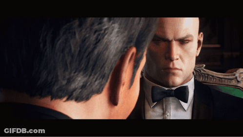 Man In Tuxedo Looking At Another Man GIF