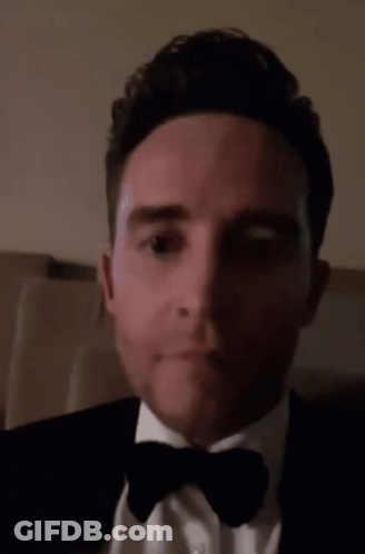 Man In Tuxedo Making Funny Face GIF