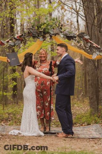 Man In Tuxedo Next To Bride In White Dress GIF