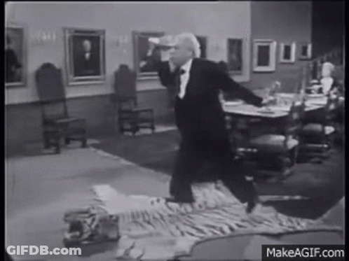 Man In Tuxedo On Tiger Skin Rug GIF