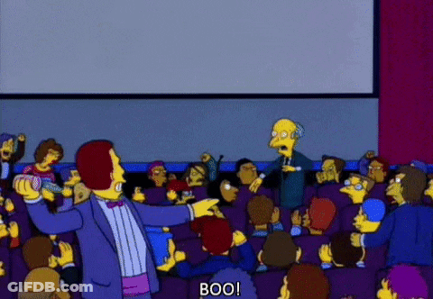 Man In Tuxedo Pointing At Crowd Saying Boo GIF
