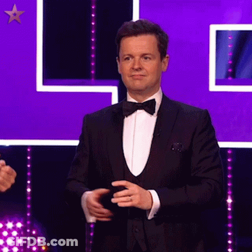 Man In Tuxedo Purple Background GIF