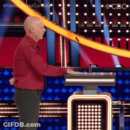 Man In Tuxedo Singing Into Microphone GIF