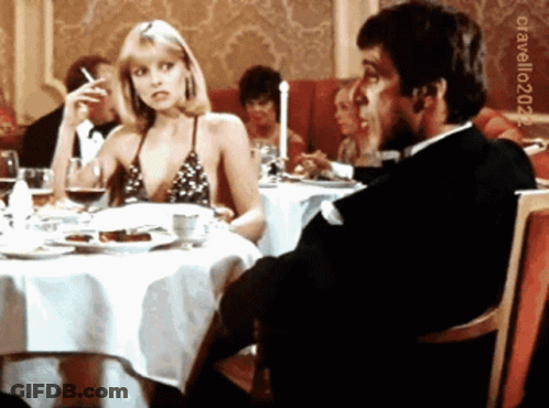 Man In Tuxedo Sitting At Table GIF