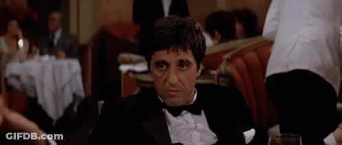 Man In Tuxedo Sitting At Table GIF