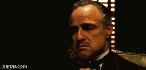 Man In Tuxedo Sitting By Window GIF