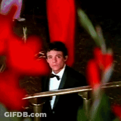 Man In Tuxedo Sitting In Chair GIF