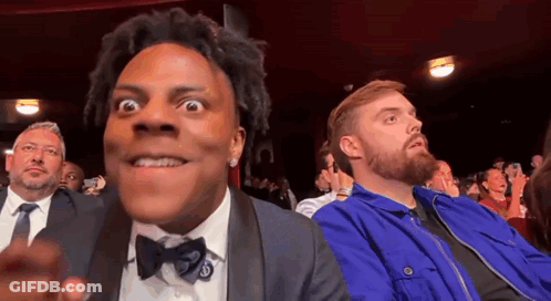 Man In Tuxedo Sitting In Theatre GIF