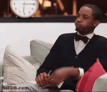 Man In Tuxedo Sitting On Couch GIF