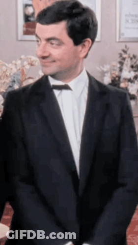 Man In Tuxedo Smiling GIF