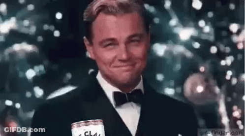 Man In Tuxedo Smiling And Holding Beer Can GIF