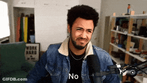 Man In Tuxedo Smiling And Looking Down GIF