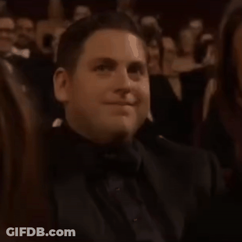 Man In Tuxedo Smiling In Applauding Crowd GIF