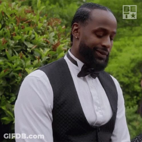 Man In Tuxedo Smiling Looking Down GIF