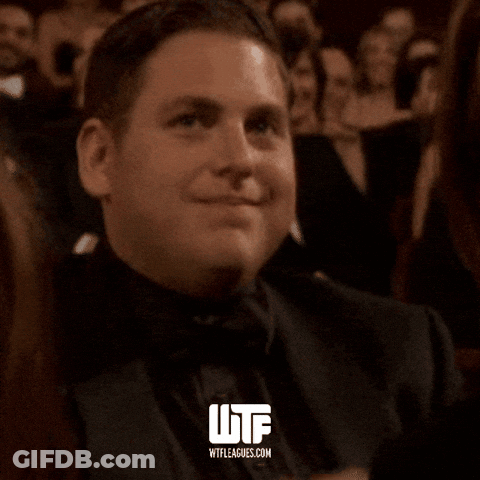 Man In Tuxedo Smiling With WTF GIF