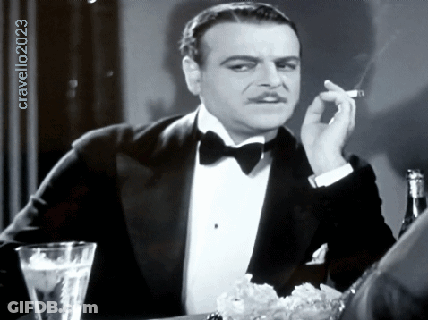 Man In Tuxedo Smoking Cigarette Black And White Photo By Cravello 2023 GIF