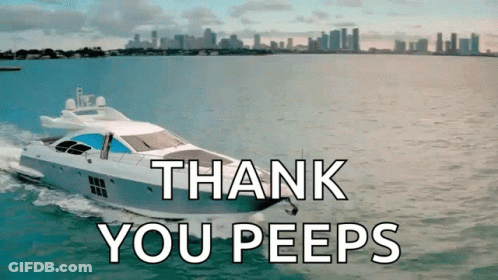 Man In Tuxedo Standing In Front Of White Yacht GIF