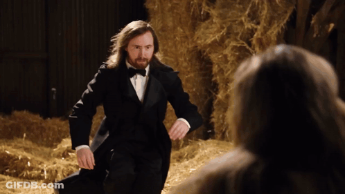 Man In Tuxedo Standing In Hay GIF