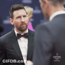 Man In Tuxedo Talking To Another GIF