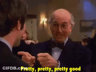 Man In Tuxedo Talking To Another Man GIF