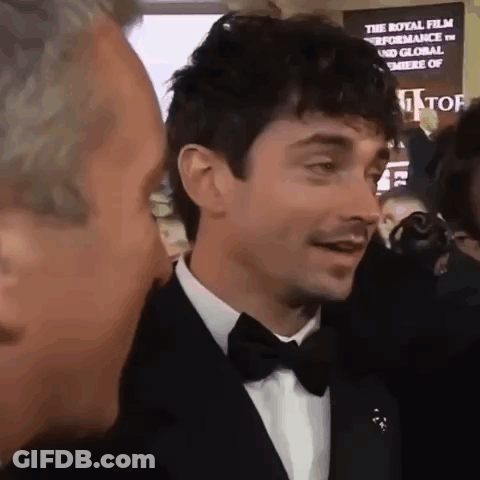 Man In Tuxedo Talking To Another GIF