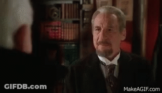 Man In Tuxedo Talking To Man In Suit GIF