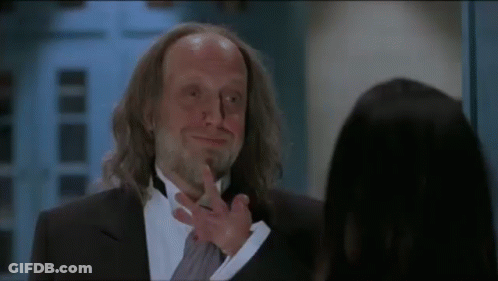 Man In Tuxedo Talking To Woman GIF