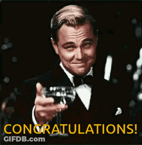 Man In Tuxedo Toasting Wine Saying Congratulations GIF