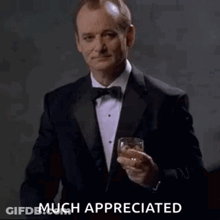 Man In Tuxedo Toasting With Whiskey GIF