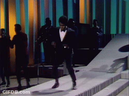 Man In Tuxedo Walking Down Stairs GIF