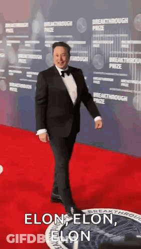 Man In Tuxedo Walking Red Carpet Says Elon Elon Elon GIF