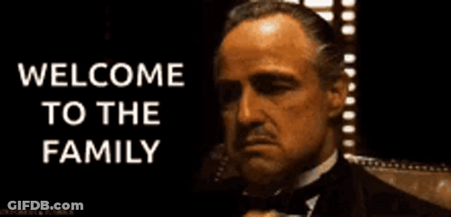 Man In Tuxedo Waving Welcome To The Family GIF
