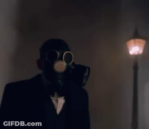 Man In Tuxedo Wearing Gas Mask GIF