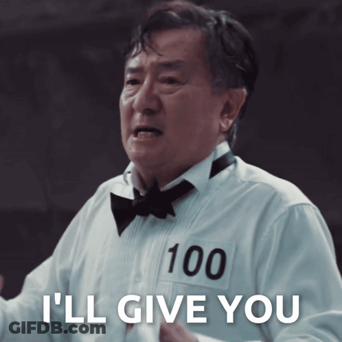 Man In Tuxedo With 100 On Shirt Says I'll Give You GIF