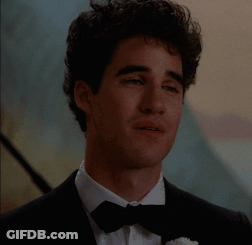 Man In Tuxedo With Bow Tie Facing Camera GIF