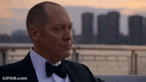 Man In Tuxedo With Bow Tie Looking At Camera GIF