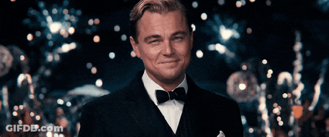 Man In Tuxedo With Bow Tie Smiles GIF