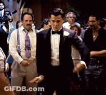 Man In Tuxedo With Flower GIF