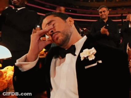 Man In Tuxedo With Flower In Pocket GIF