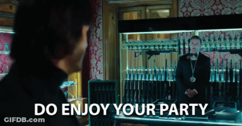 Man In Tuxedo With Guns And Do Enjoy Your Party GIF
