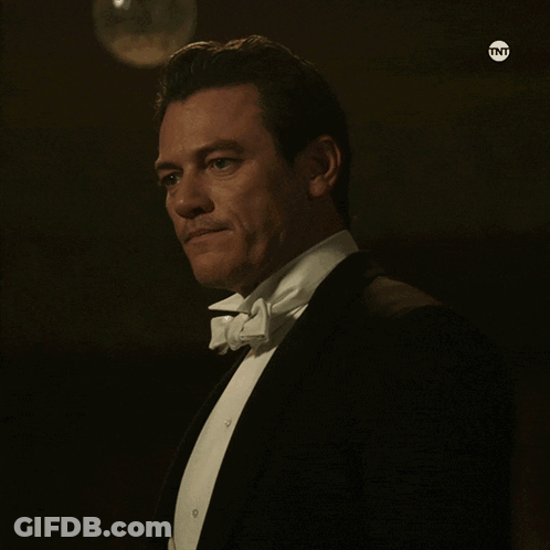 Man In Tuxedo With TNT On Bottom Right GIF