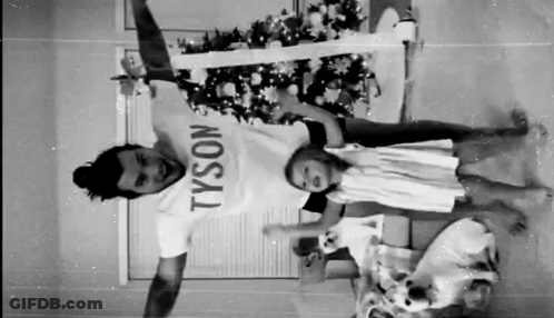 Man In Tyson T-Shirt Holding Two Children GIF