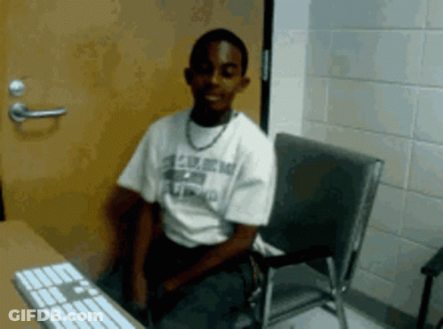 Man In U.S. Army Shirt At Computer GIF