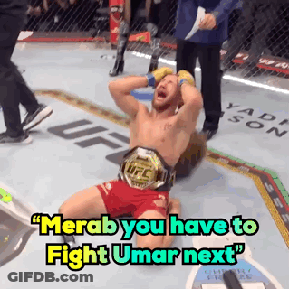 Man In UFC Belt Laying On Ground GIF